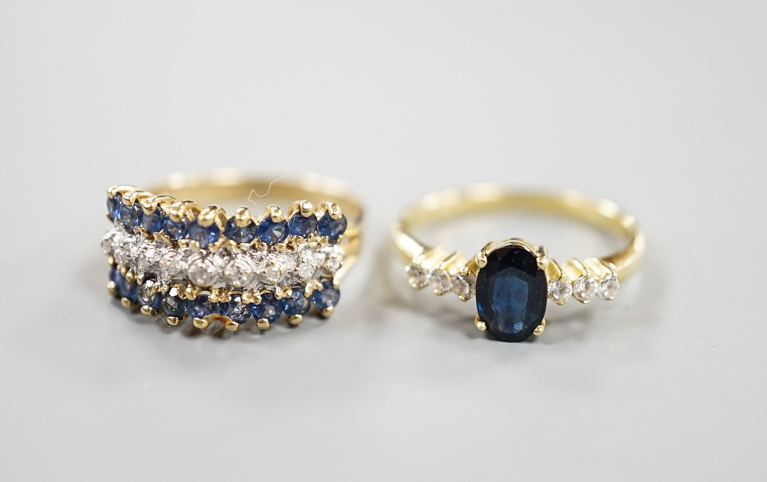 Two modern 14k yellow metal, sapphire and diamond set dress rings, sizes L & K/L, gross weight 5.1 grams.
